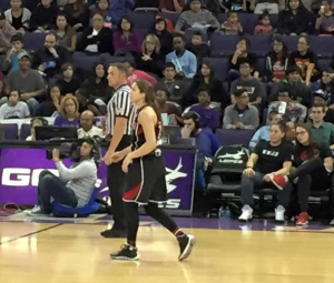 Shoni Schimmel watches sister Jude at the GCU game in Phoenix. (Photo via Wade Henderson)