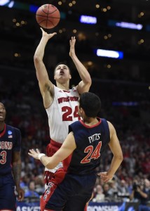 Wisconsin Badgers guard Bronson Koenig (24) shoots against Arizona Wildcats guard Elliott Pitts (24) during the first half in the finals of the west regional of the 2015 NCAA Tournament at Staples Center. Mandatory Credit: Richard Mackson-USA TODAY Sports