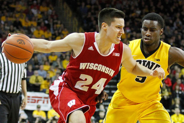 Bronson Koenig (Ho-Chunk Nation) scored 15 points as Wisconsin upset eighth-ranked Iowa, 67-59