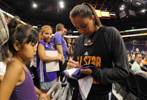 Shoni Schimmel signs autographs for fans at the WNBA All-Star game.