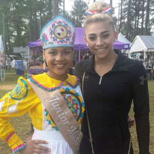 Junior Miss Lumbee Kaloni Skye Walton and Olympic gymnast Ashton Locklear pose for a picture at the Lumbee Homecoming Pow Wow at the University of North Carolina Pembroke. Photo courtesy of Jackie Jacobs 